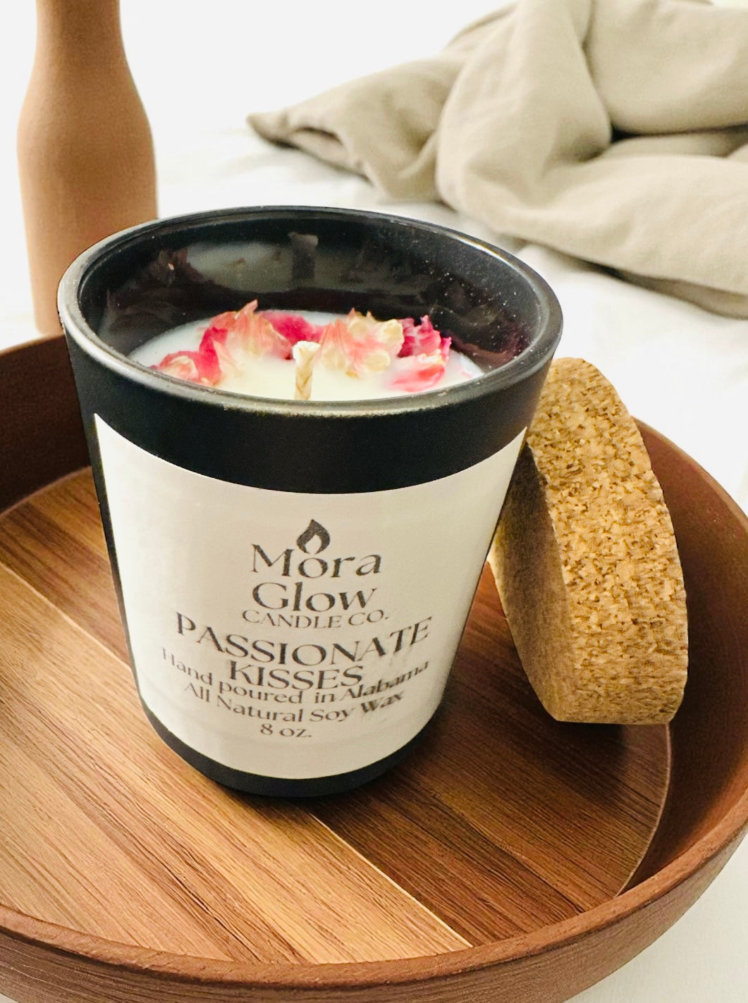“Hand-poured Passionate Kisses candle creating romantic ambiance”
